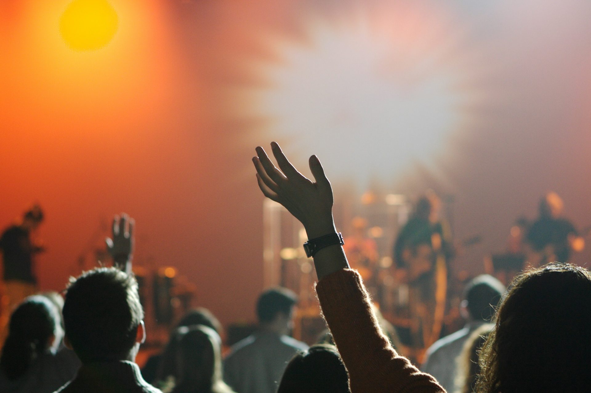 Hands raised at concert