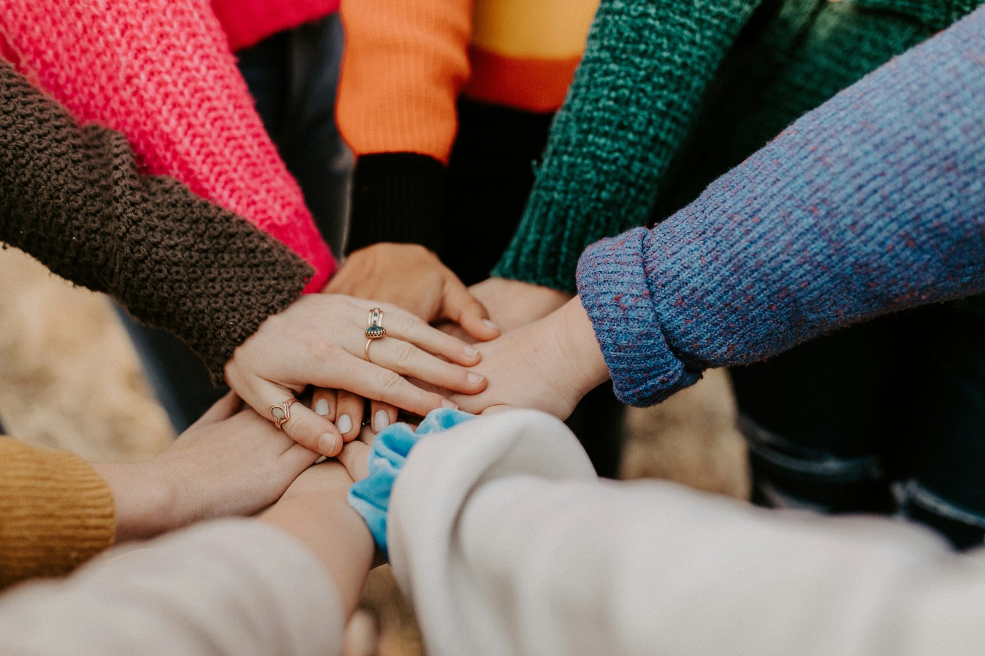 Many hands together in friendship